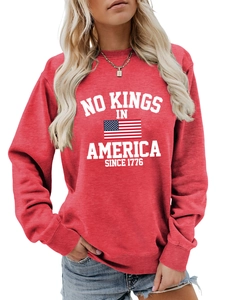 Detail of red crewneck sweatshirt with No Kings in America print and flag graphic