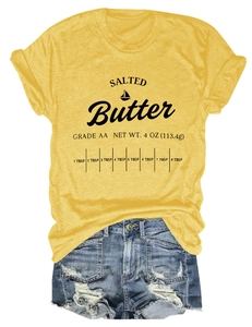 Detail of salted butter graphic print on a yellow casual short sleeve cotton t-shirt
