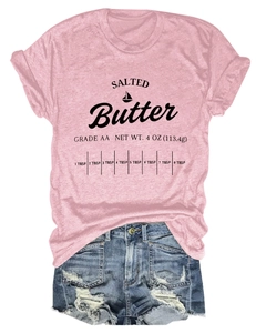 Close-up of pink cotton T-shirt featuring Salted Butter letter print and vintage denim shorts