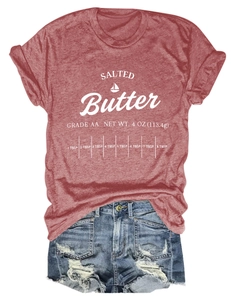 Close-up of Salted Butter graphic print on vintage red cotton t-shirt with denim shorts
