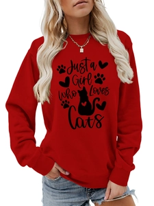 Detail of red crewneck sweatshirt featuring Just a Girl Who Loves Cats text and cat graphic