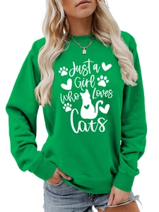 Close-up of green crewneck sweatshirt with 'Just a Girl Who Loves Cats' print and ribbed cuffs