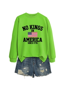 Detail of neon green crewneck sweatshirt with No Kings In America 1776 graphic print