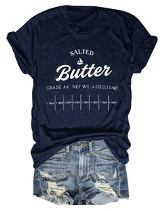 Flat lay of navy blue cotton T-shirt with salted butter print and denim shorts on white background