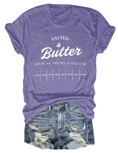 Flat lay of purple cotton T-shirt with Salted Butter print and blue ripped denim shorts