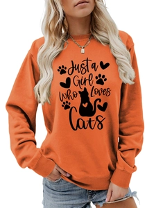 Detailed shot of orange crewneck sweatshirt featuring Just a Girl Who Loves Cats print