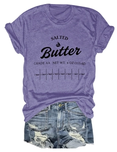 Flat lay of purple cotton T-shirt with butter print and distressed blue denim shorts