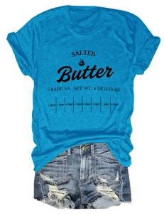 Flat lay of light blue T-shirt with Salted Butter print and ripped denim shorts