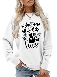 Detail of Just a Girl Who Loves Cats text and feline silhouettes on white sweatshirt