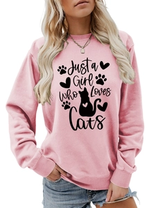 Close-up of pink crewneck sweatshirt featuring black Just a Girl Who Loves Cats print