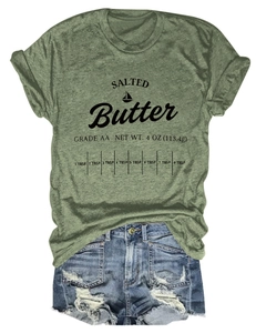 Detail of green crewneck T-shirt with salted butter print and denim shorts