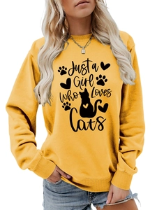 Detail of ginger yellow sweatshirt featuring Just a Girl Who Loves Cats text and cat graphic