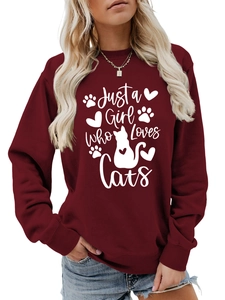 Detail of Just a Girl Who Loves Cats white print on wine red long sleeve crewneck sweatshirt