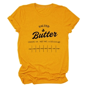 Detail of ginger yellow cotton t-shirt featuring salted butter graphic and rolled sleeves