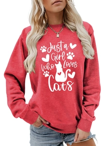 Detail of red crewneck sweatshirt with Just a Girl Who Loves Cats white print and ribbed cuffs