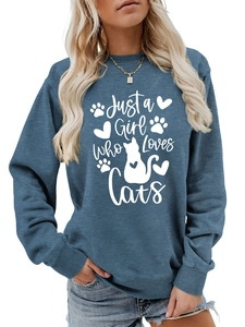 Detail of greyish-blue sweatshirt featuring Just a Girl Who Loves Cats text and graphics