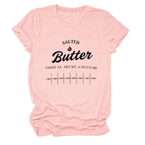 Close-up of pink cotton T-shirt featuring black Salted Butter graphic and grade AA print