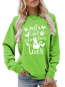 Close-up of Just a Girl Who Loves Cats print on a bright green casual sweatshirt