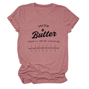 Detail of salted butter graphic print on a pink crew neck short sleeve cotton T-shirt