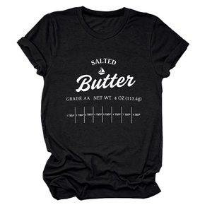 Detailed close-up of white screen-printed butter label design on black cotton t-shirt