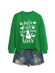 Close-up of green crewneck sweatshirt with white Just a Girl Who Loves Cats print