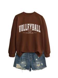 Detail of Volleyball Mama dark brown sweatshirt with athletic print and denim shorts