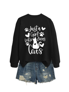 Detail of Just a Girl Who Loves Cats white print on a black crewneck sweatshirt