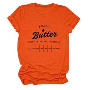 Close-up of bright orange crewneck t-shirt with black salted butter graphic print detail