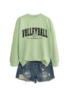 Detail view of Volleyball Mama varsity text and ball icon on light green cotton sweatshirt