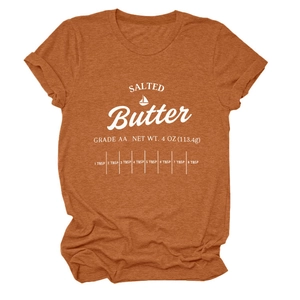 Close-up of salted butter print design on caramel cotton crew neck t-shirt detail