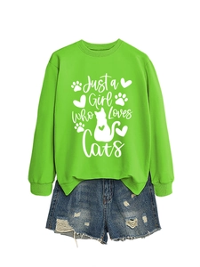 Detail of green sweatshirt with Just a Girl Who Loves Cats text and feline graphics
