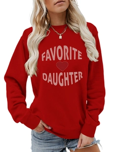 Detail of red crewneck sweatshirt with pink Favorite Daughter text and heart print