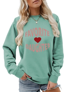 Detail of mint green sweatshirt featuring pink Favorite Daughter print and red heart