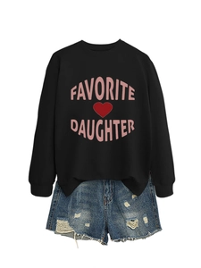 Detail of black crewneck sweatshirt with pink Favorite Daughter text and denim shorts