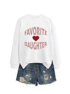 Flat lay of a white crewneck sweatshirt with pink Favorite Daughter text and denim shorts