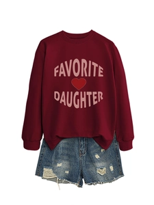 Detail of burgundy crewneck sweatshirt with pink Favorite Daughter text and denim shorts