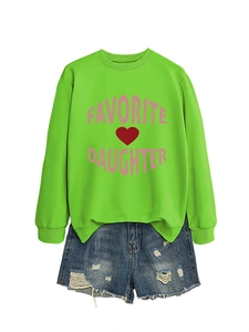 Flat lay of bright green crewneck sweatshirt with pink Favorite Daughter text and denim shorts