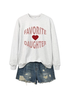 Flat lay of gray Favorite Daughter sweatshirt with heart print and denim shorts