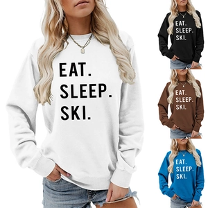 Detail view of Eat Sleep Ski printed sweatshirts in white, black, brown, and blue colors