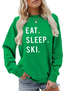 Detail of emerald green sweatshirt with white Eat Sleep Ski bold letter printing