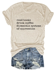 Flat lay of beige T-shirt with black slogan paired with distressed blue denim shorts