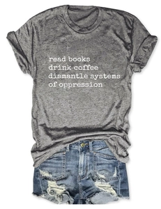 Flat lay of gray cotton t-shirt with book slogan and distressed blue denim shorts