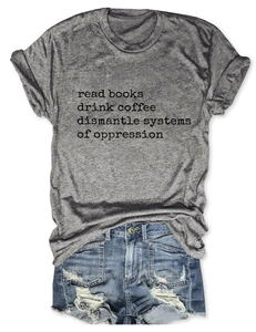 Flat lay of gray cotton t-shirt with book slogan and distressed denim shorts