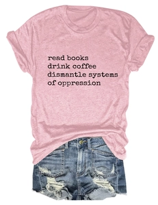 Detailed view of pink cotton t-shirt with read books coffee print and ripped denim shorts
