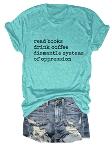 Detail of turquoise cotton T-shirt with 'read books' text and ripped denim shorts