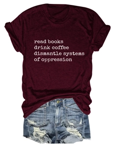 Detail of cotton T-shirt with 'read books drink coffee' slogan and denim shorts