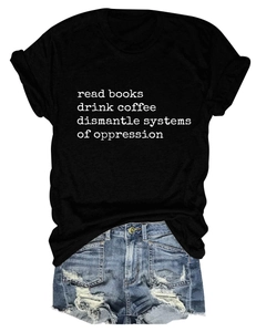Close-up of black Read Books T-shirt paired with distressed blue denim shorts texture