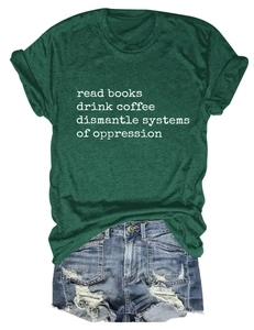 Flat lay of dark green heather t-shirt with slogan and distressed denim shorts