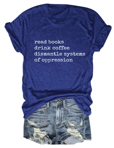 Flat lay of navy blue slogan t-shirt paired with light blue distressed denim shorts