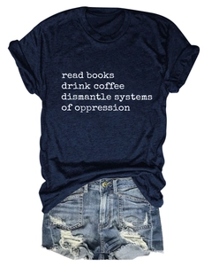 Detail of navy T-shirt with 'read books drink coffee' slogan and distressed denim shorts